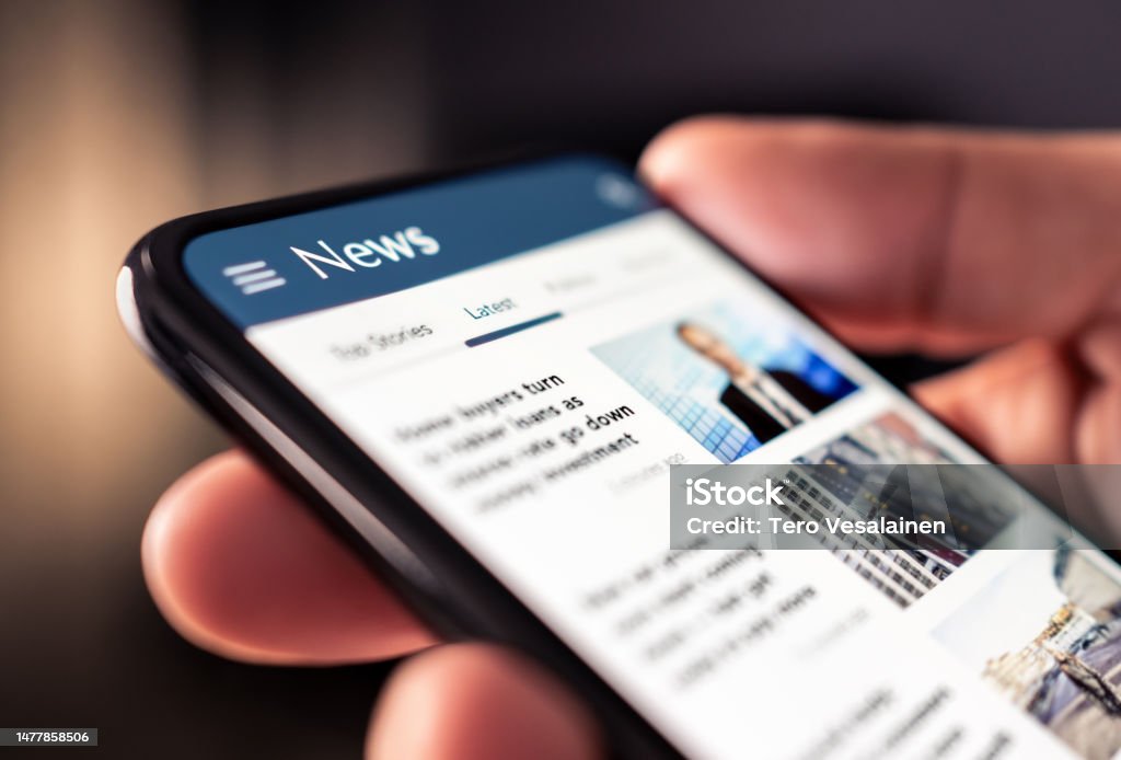 Smartphone displaying news articles